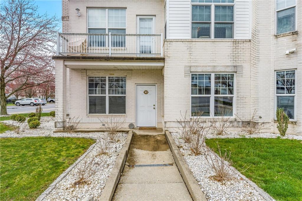 216 Adams Pointe Boulevard, Unit 10 Mars, PA 16046 - Photo 5 of 33 a front view of a house with garden