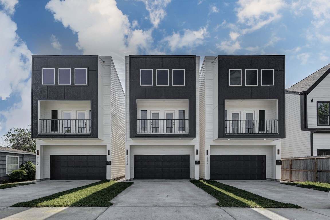 Investment opportunity at 7115B England St – striking new construction with modern façade, private 2-car garage, second-story balcony, and standout curb appeal