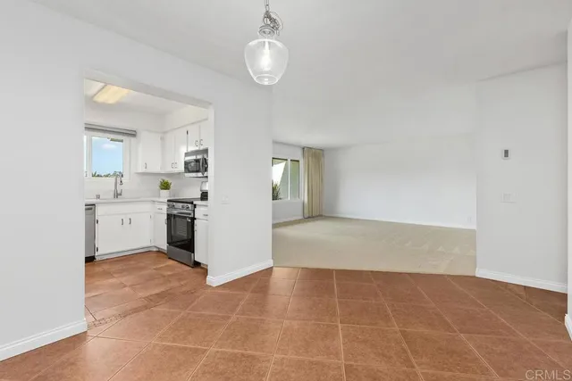 a view of a kitchen with a sink cabinets and window