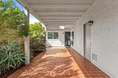 a lobby with furniture and potted plant