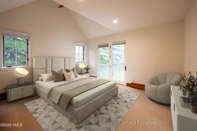 a bedroom with bed and a couch