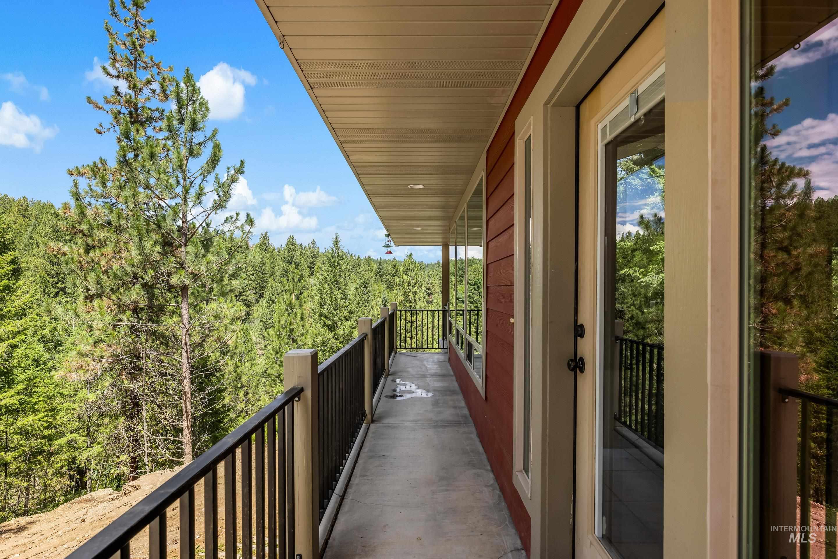 92 Cruickshank Road Horseshoe Bend, ID 83629 - Photo 3 of 50 Expansive outdoor balcony featuring a concrete surface and black metal railing