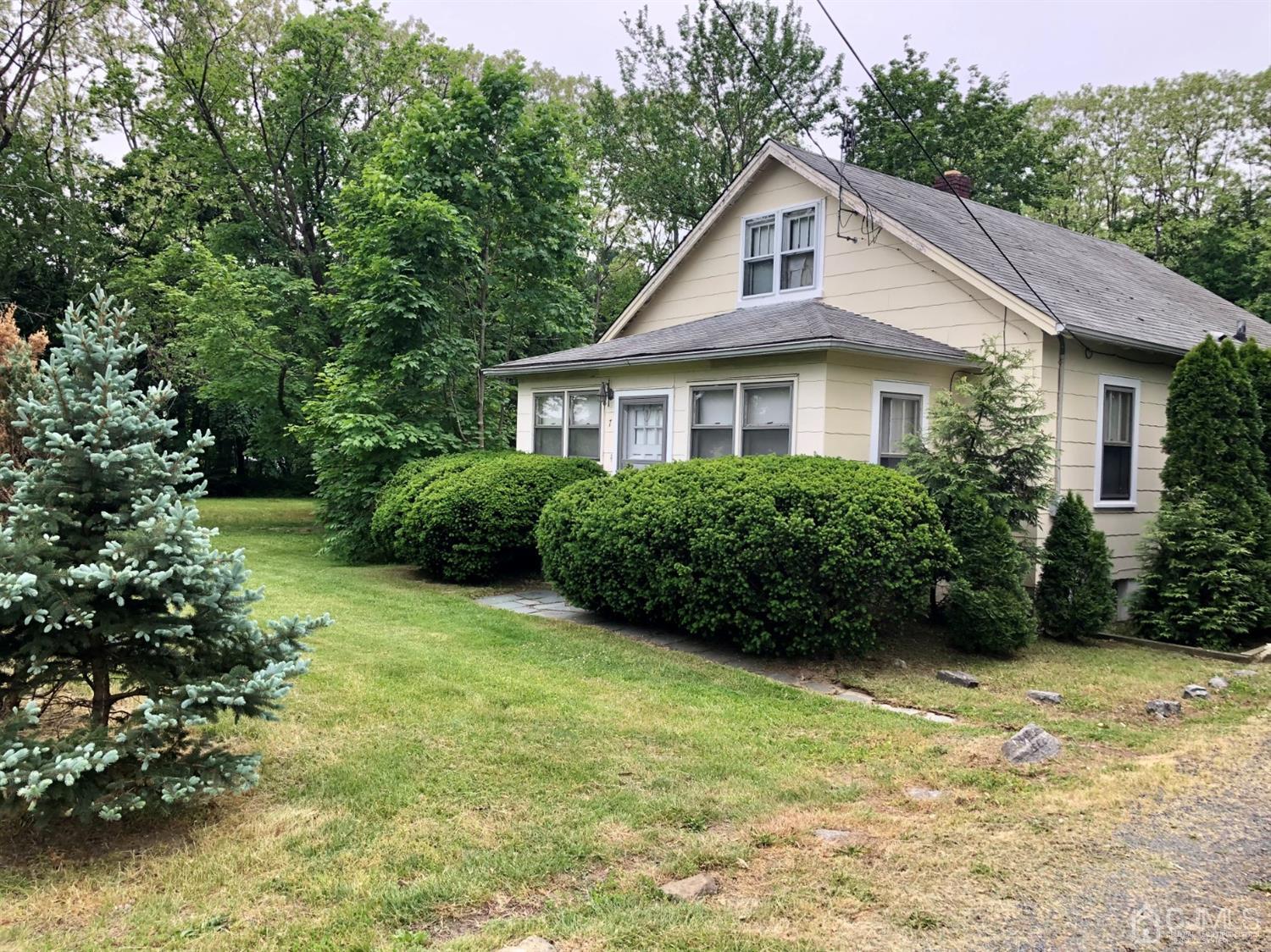 7 Spring Hill Road Old Bridge, NJ 07747 - Photo 1 of 11 a front view of a house with garden