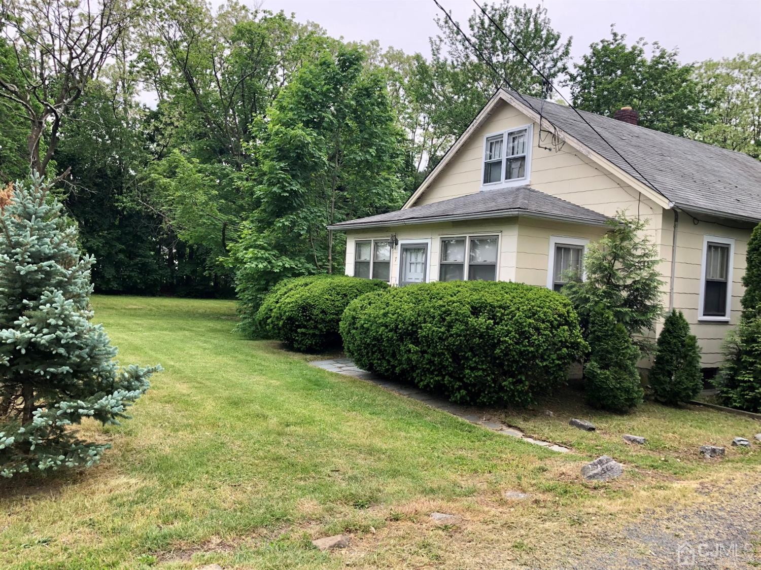 7 Spring Hill Road Old Bridge, NJ 07747 - Photo 11 of 11 a front view of a house with a yard