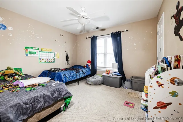 a bedroom with bed and a window