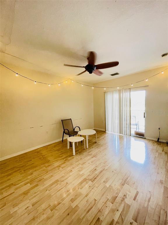 8201 Claire Ann Drive, Unit 202 Orlando, FL 32825 - Photo 7 of 17 a view of a workspace with wooden floor and furniture