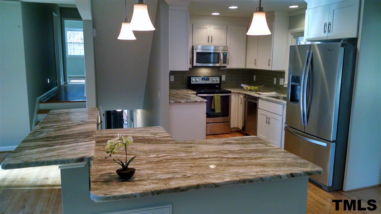 1224 Kingston Ridge Road Cary, NC 27511 - Photo 3 of 24 This kitchen was gutted to the studs and completely rebuilt to the highest quality.