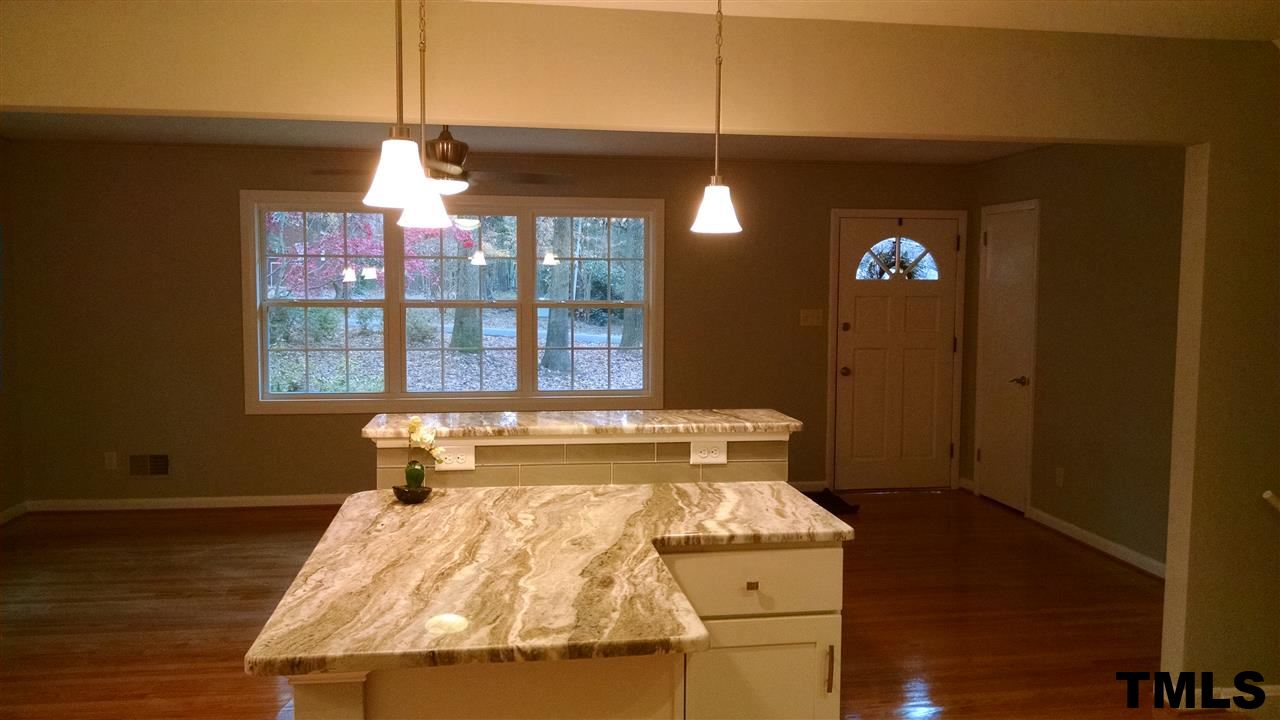 1224 Kingston Ridge Road Cary, NC 27511 - Photo 24 of 24 Wide open floor plan connects the kitchen, living, and dining areas.
