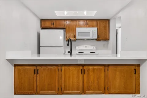 a bathroom with a sink a mirror and a window