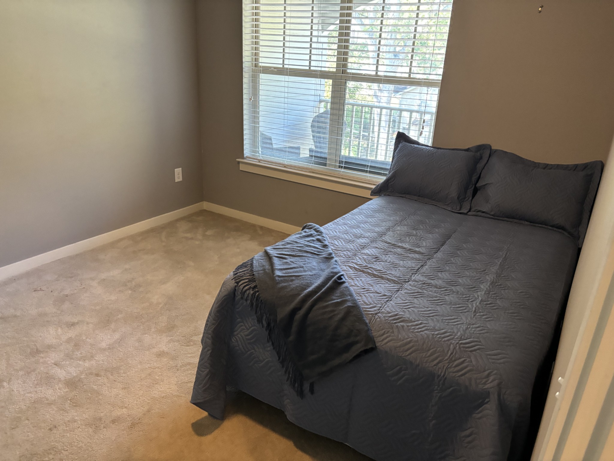 414 Rosedale Avenue, Unit 301 Nashville, TN 37211 - Photo 13 of 21 a bed sitting in a bedroom next to a window