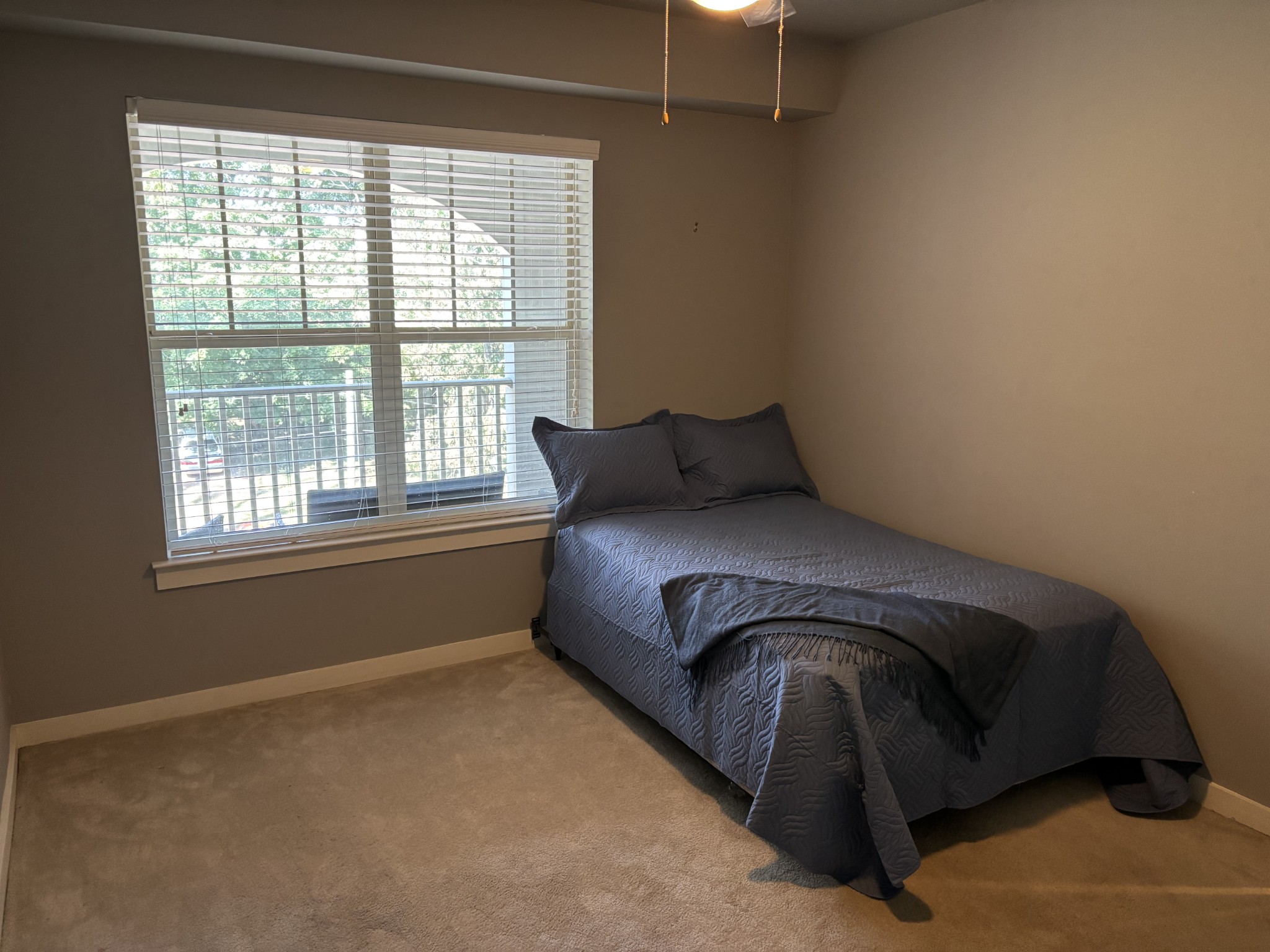 414 Rosedale Avenue, Unit 301 Nashville, TN 37211 - Photo 21 of 21 a bed sitting in a bedroom next to a window
