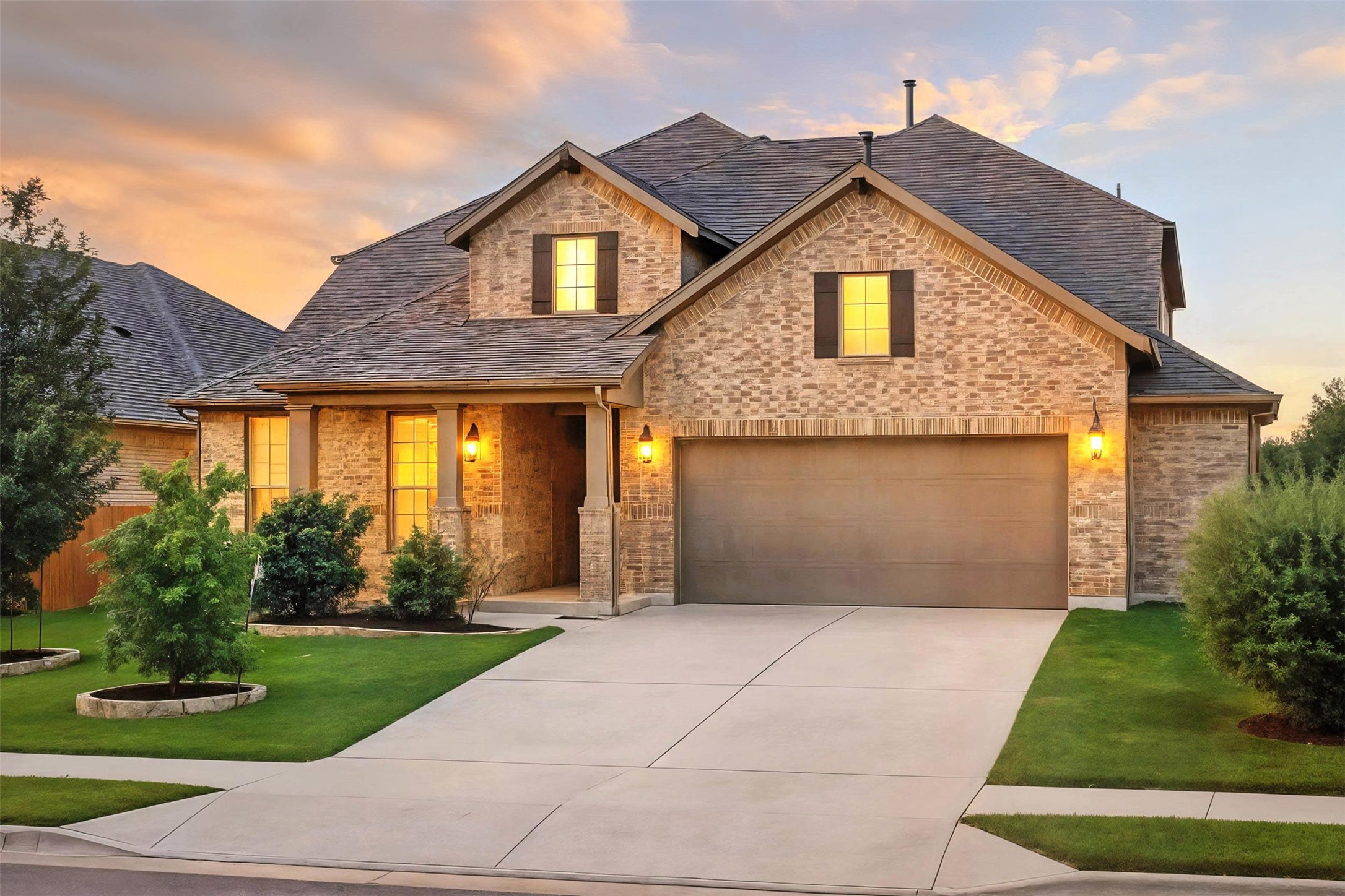 3054 Columbus Loop Round Rock, TX 78665 - Photo 1 of 40 View of front of house featuring a front yard, brick siding, driveway, a porch, and a high end roof