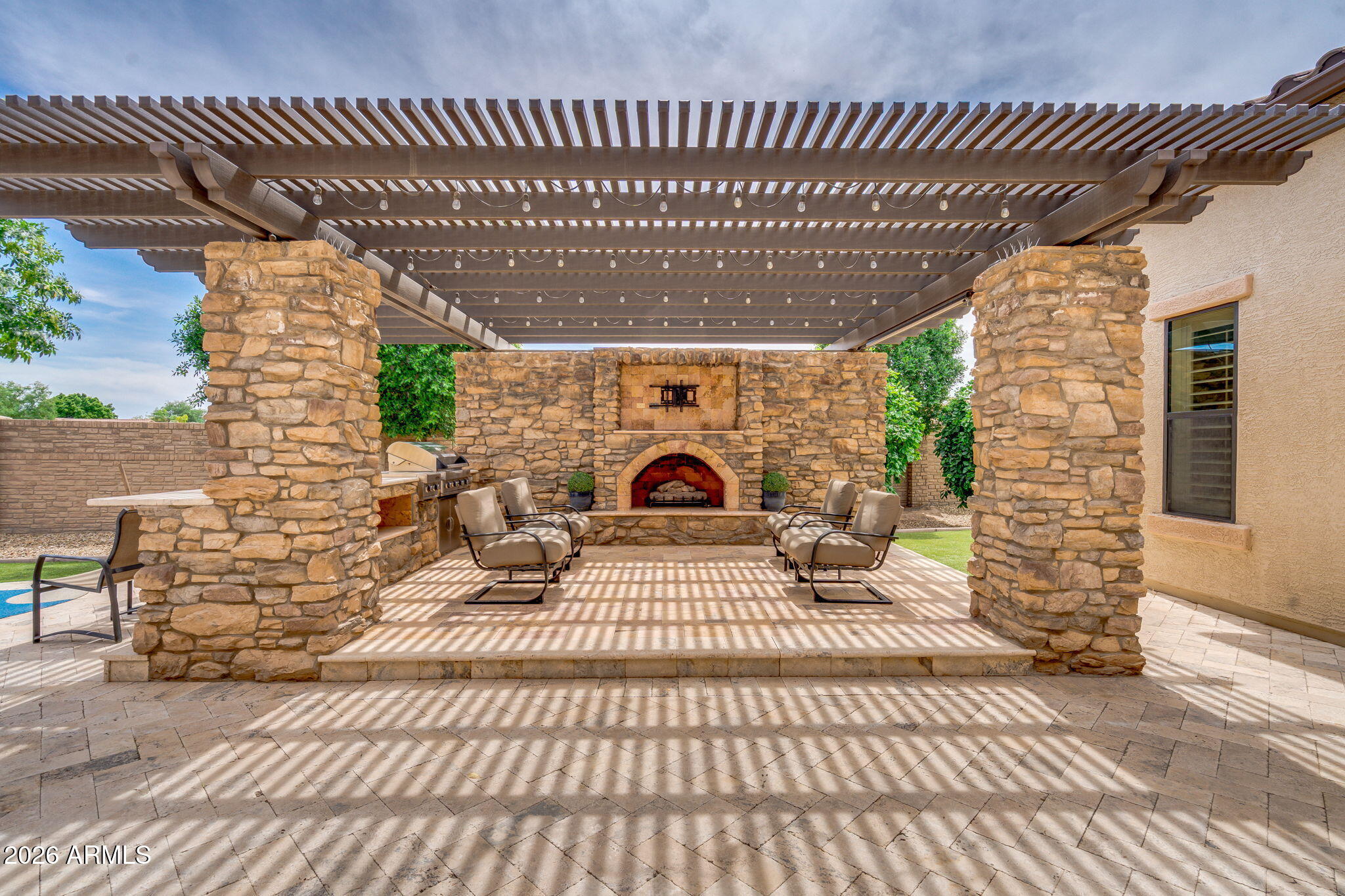 2471 East Robin Court Gilbert, AZ 85296 - Photo 46 of 54 Pergola with fireplace and built in BBQ