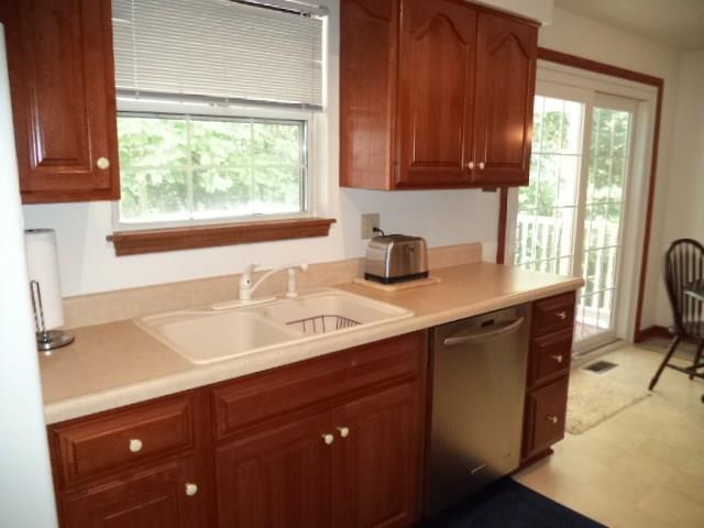 110 Cedar Ridge Drive Monaca, PA 15061 - Photo 5 of 22 Kitchen - notice the new stainless steel dishwasher and eat-in area with sliding glass doors to covered deck