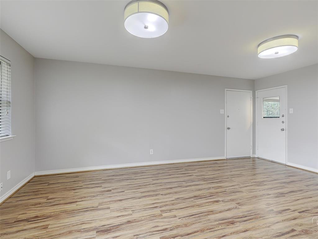 4079 Calculus Drive Dallas, TX 75244 - Photo 13 of 26 a view of room with wooden floor and window