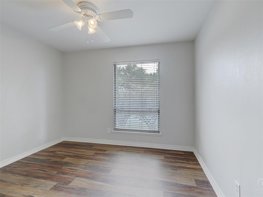 4079 Calculus Drive Dallas, TX 75244 - Photo 18 of 26 an empty room with wooden floor and windows