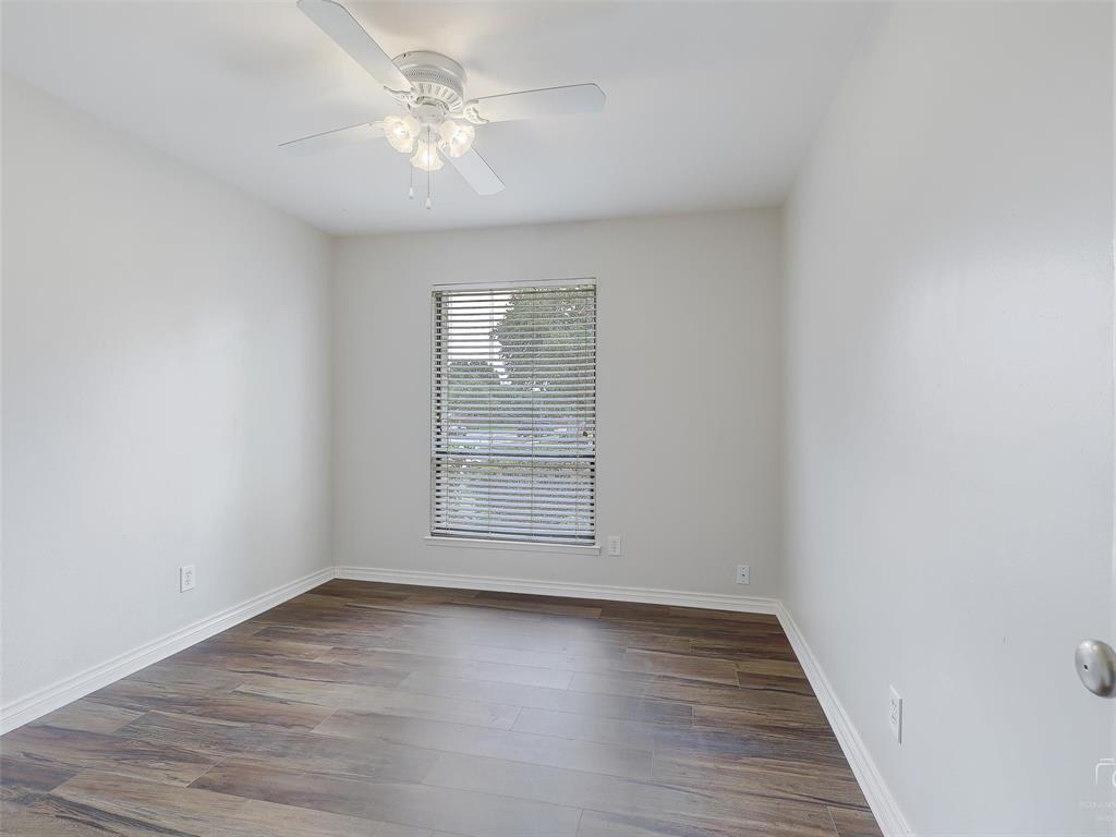 4079 Calculus Drive Dallas, TX 75244 - Photo 19 of 26 wooden floor in an empty room with a window