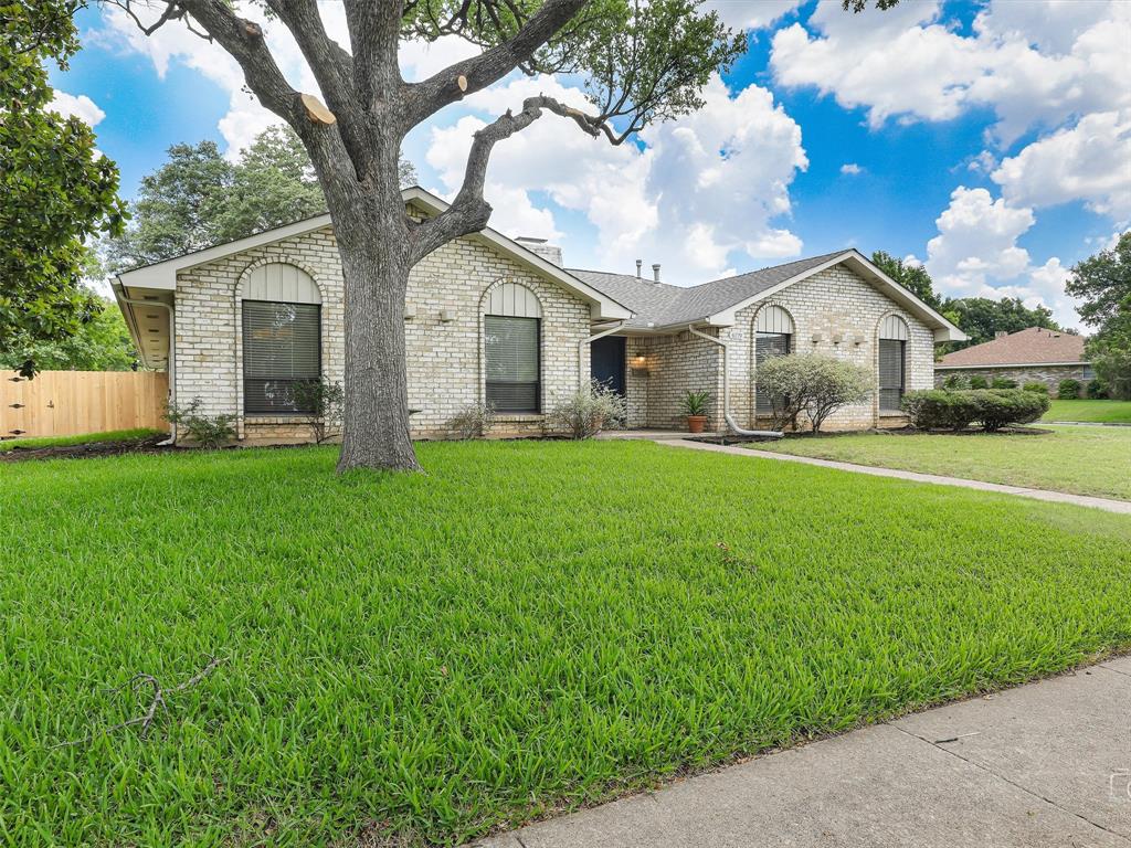 4079 Calculus Drive Dallas, TX 75244 - Photo 2 of 26 a front view of house with yard and green space