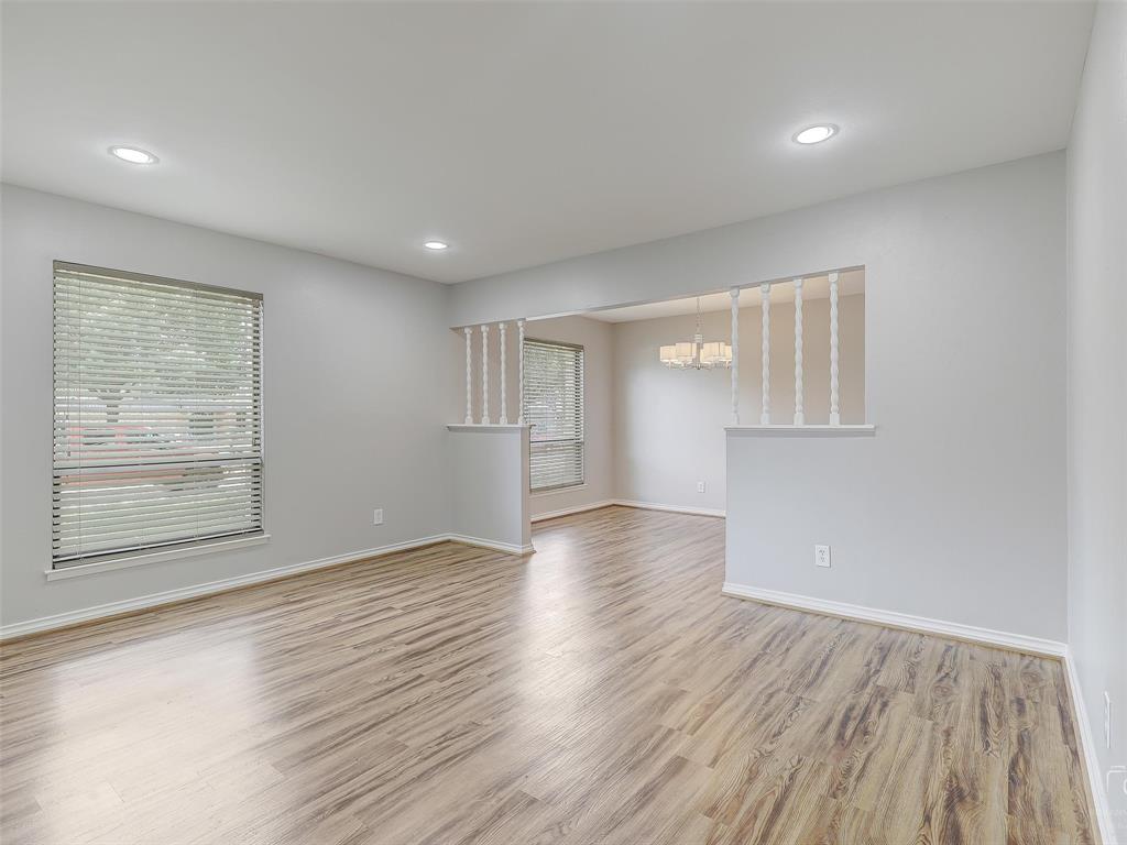 4079 Calculus Drive Dallas, TX 75244 - Photo 6 of 26 an empty room with wooden floor and windows