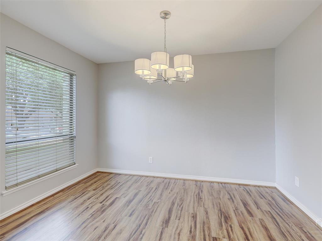 4079 Calculus Drive Dallas, TX 75244 - Photo 7 of 26 a view of a room with wooden floor and windows