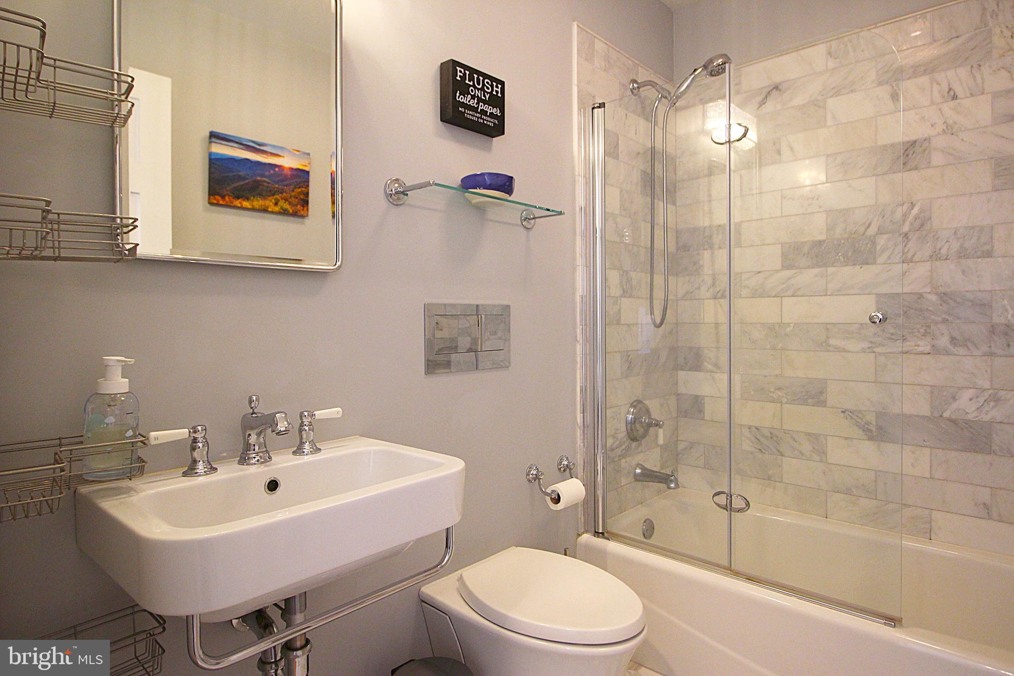 2602 Lookout Road Haymarket, VA 20169 - Photo 11 of 32 a bathroom with a sink toilet and shower