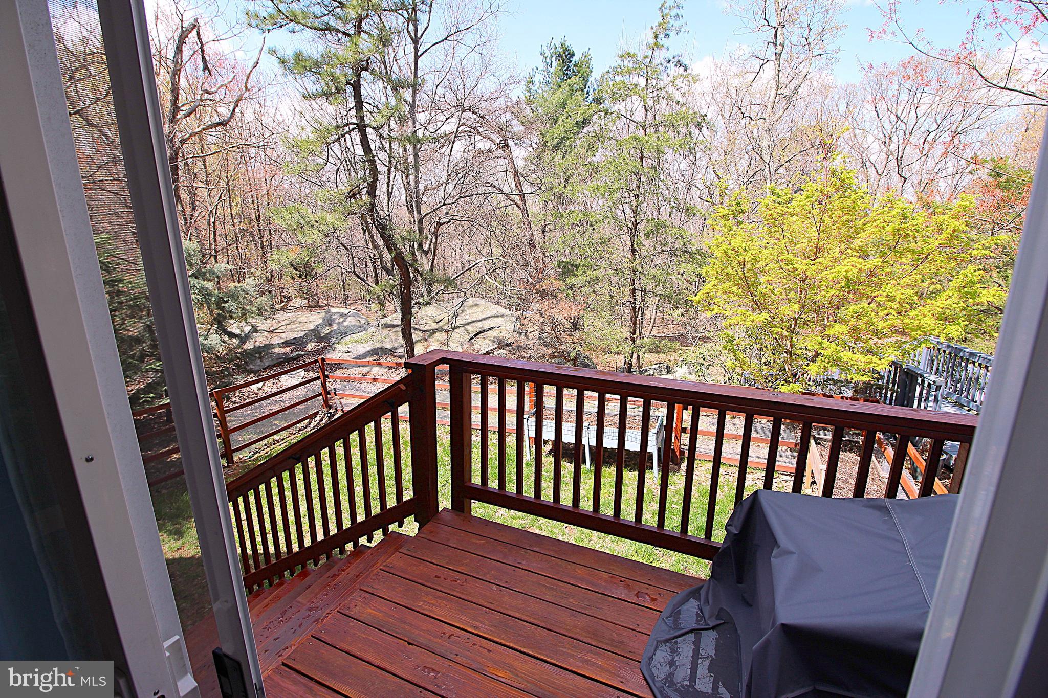 2602 Lookout Road Haymarket, VA 20169 - Photo 12 of 32 a view of a wooden chairs on a deck