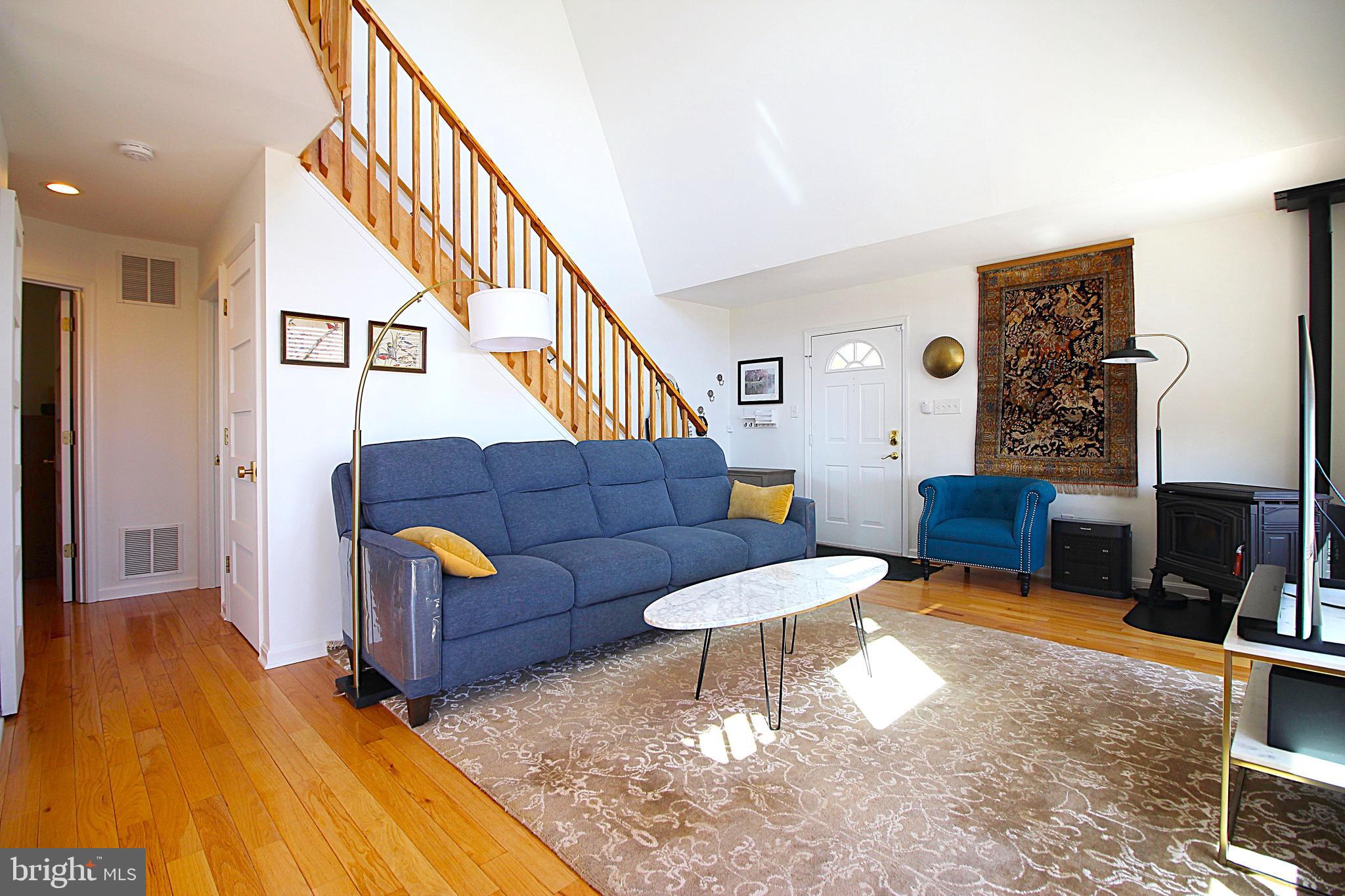 2602 Lookout Road Haymarket, VA 20169 - Photo 20 of 32 a living room with furniture and a wooden floor