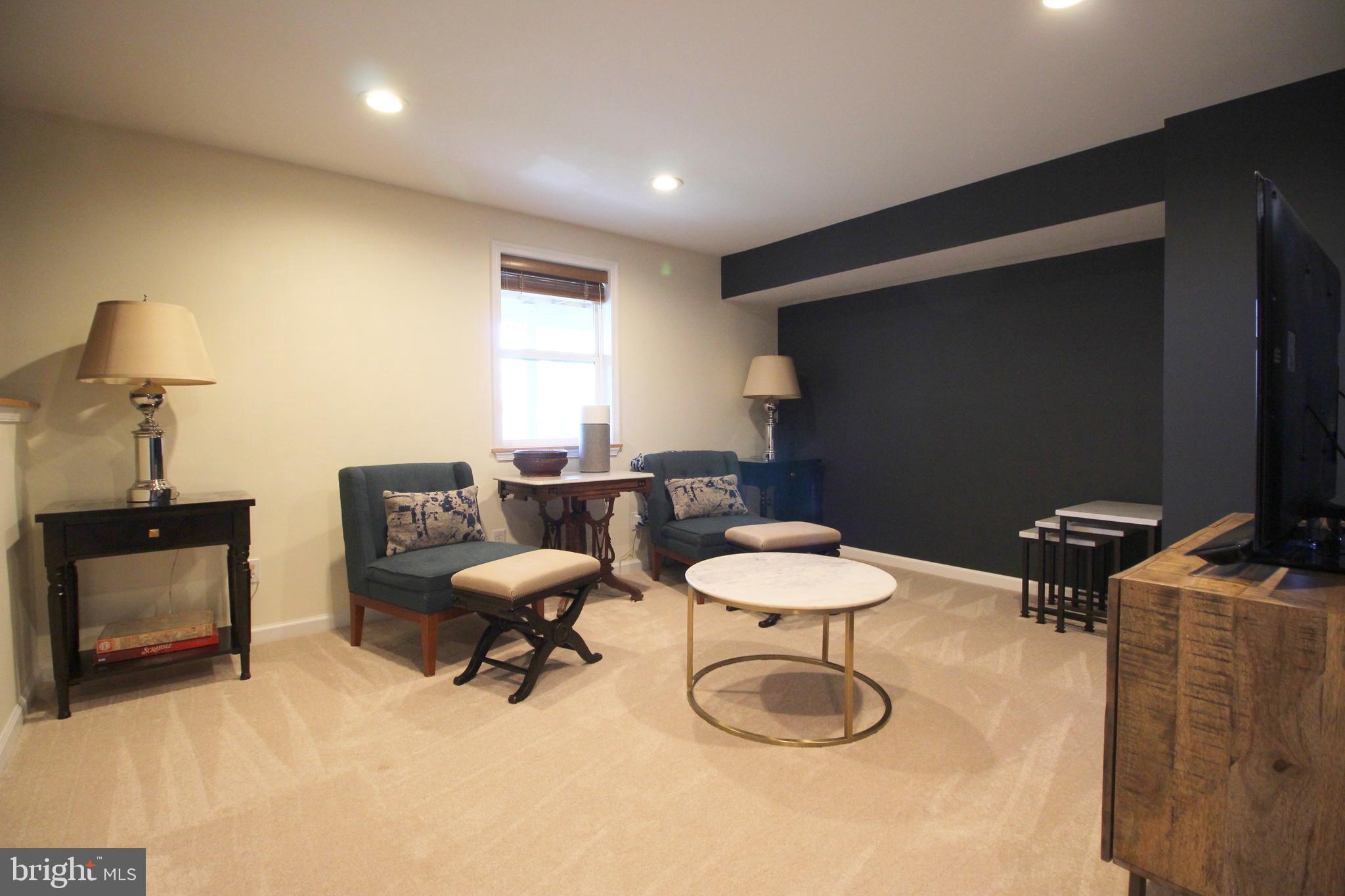 2602 Lookout Road Haymarket, VA 20169 - Photo 27 of 32 a room with furniture a lamp and a window