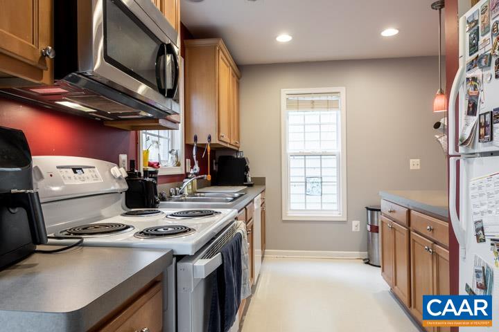 100 Roy's Place Charlottesville, VA 22902 - Photo 15 of 29 a kitchen with stainless steel appliances granite countertop a stove a sink dishwasher and cabinets with wooden floor
