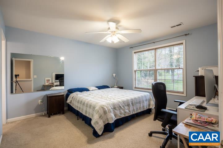 100 Roy's Place Charlottesville, VA 22902 - Photo 17 of 29 a bedroom with a bed and a desk