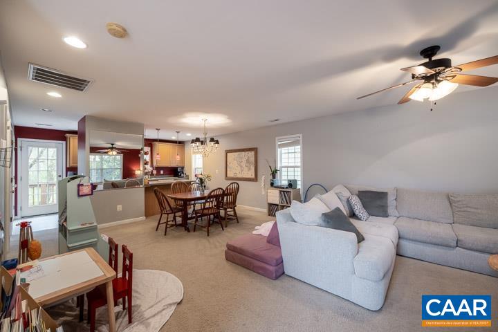 100 Roy's Place Charlottesville, VA 22902 - Photo 9 of 29 a living room with furniture and a chandelier