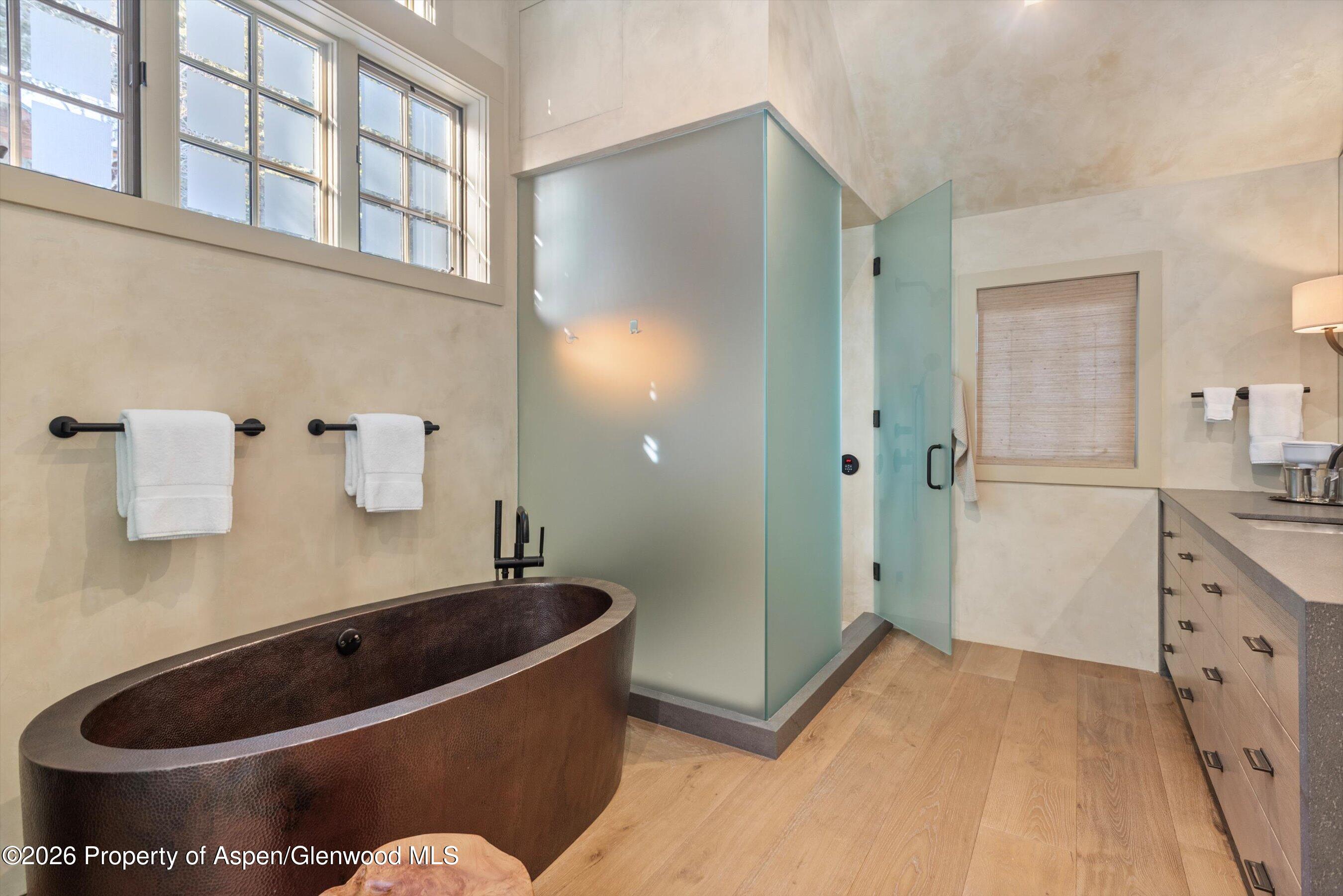 1271 Ute Avenue Aspen, CO 81611 - Photo 16 of 53 a bathroom with a tub a sink and a shower