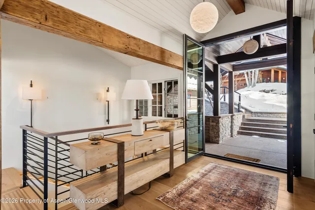 a living room with furniture and a table