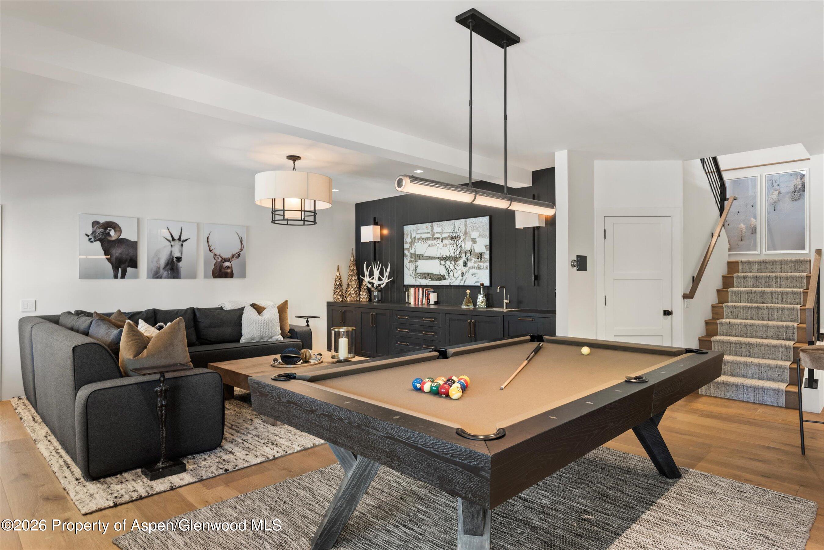 1271 Ute Avenue Aspen, CO 81611 - Photo 18 of 53 a living room with furniture and a table