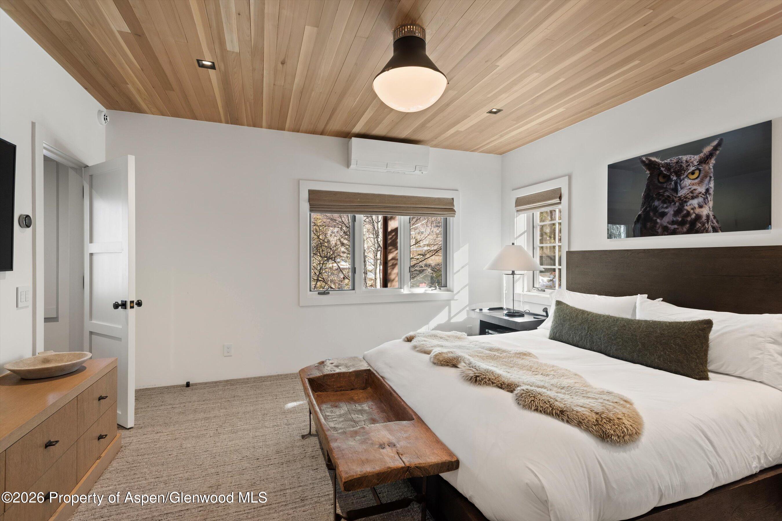 1271 Ute Avenue Aspen, CO 81611 - Photo 24 of 53 a bedroom with a bed and a cabinets