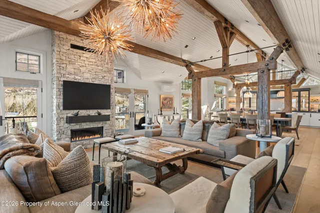 a living room with fireplace furniture and a flat screen tv