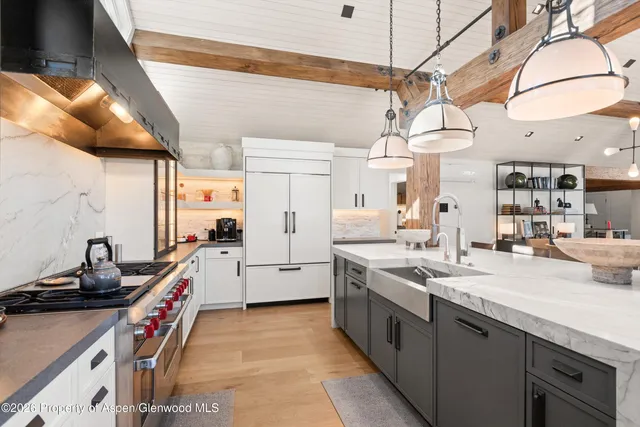a very nice looking open kitchen with a stove