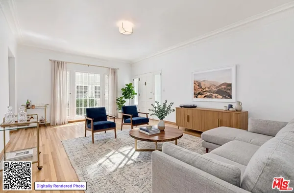 a living room with furniture a rug and a large window