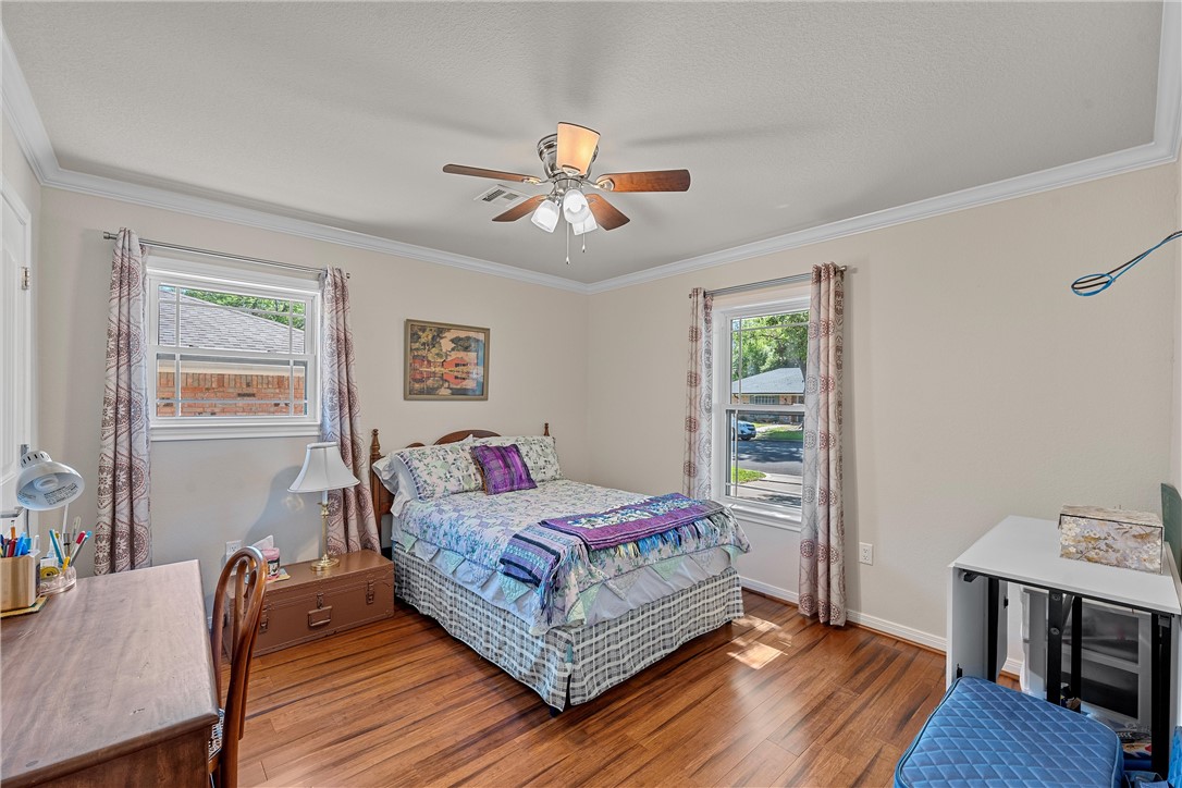 1929 Trinity Drive Waco, TX 76710 - Photo 16 of 22 a living room with a bed furniture and a window