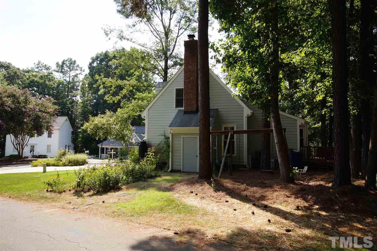7033 Sandringham Court Raleigh, NC 27613 - Photo 24 of 25 a pathway of a house with a yard