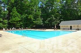 7033 Sandringham Court Raleigh, NC 27613 - Photo 25 of 25 a view of a swimming pool with an outdoor space
