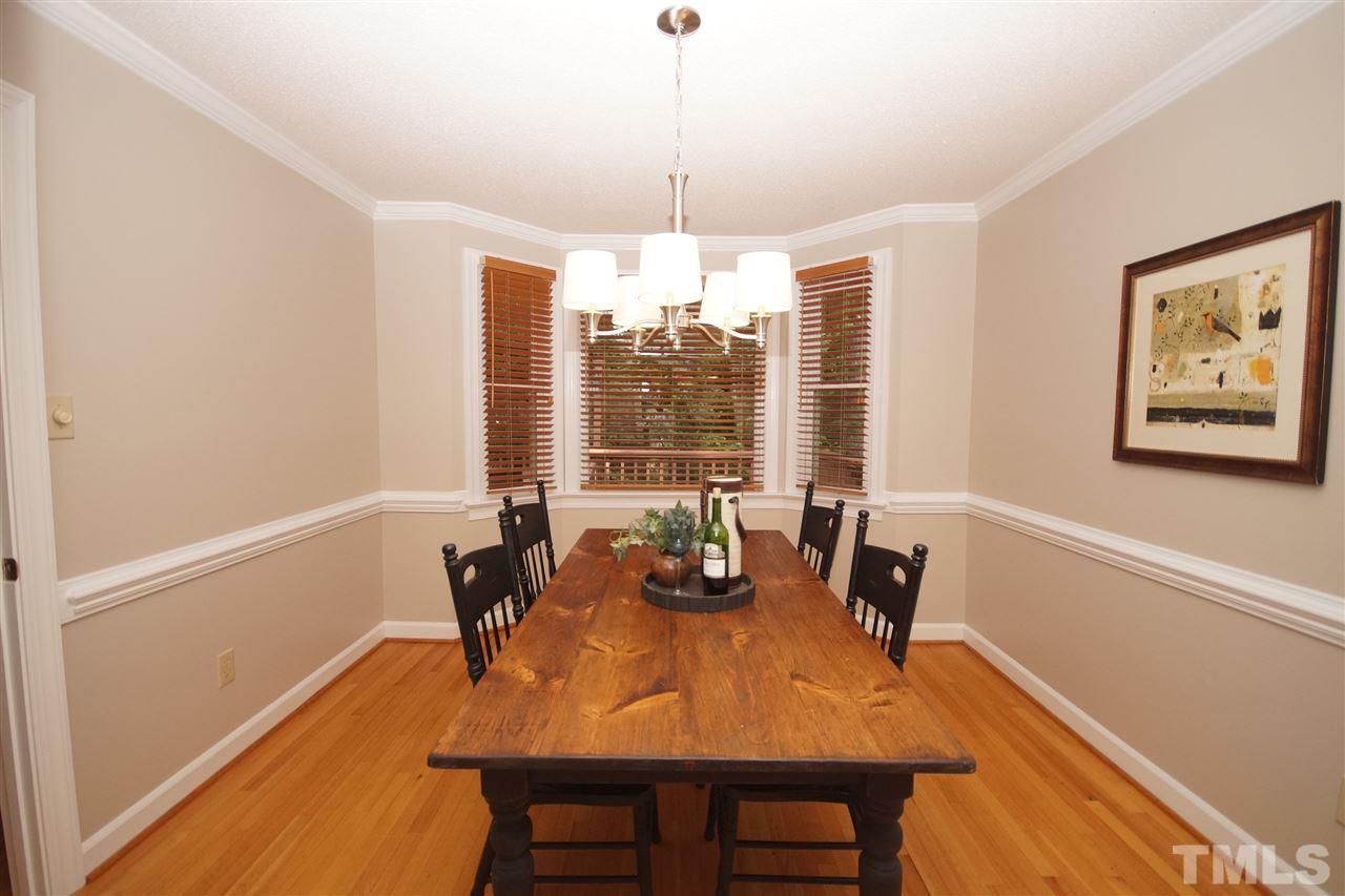 7033 Sandringham Court Raleigh, NC 27613 - Photo 7 of 25 a dining room with furniture and window
