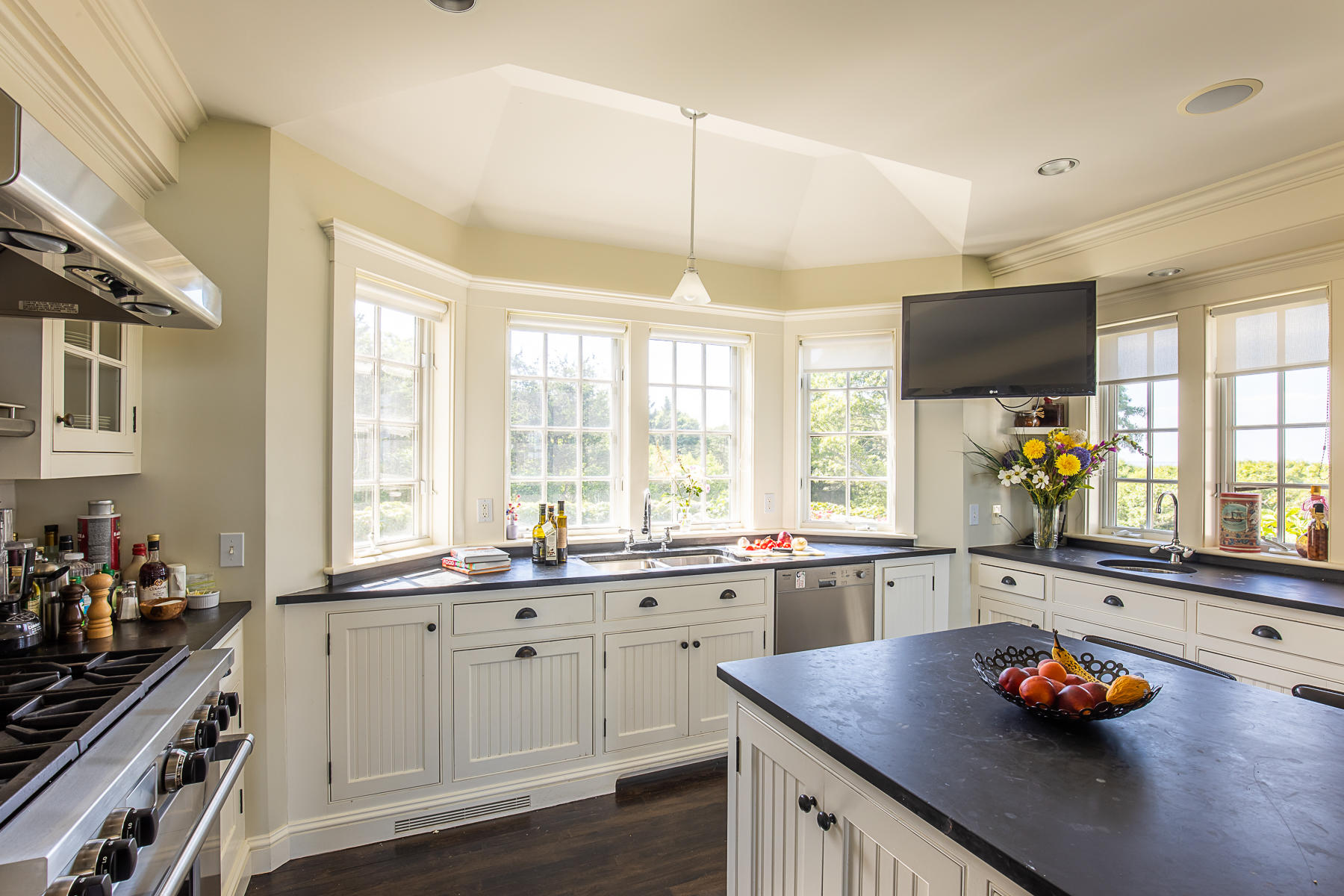 7 Clay Pit Road Aquinnah, MA 02535 - Photo 16 of 29 a kitchen with stainless steel appliances a sink stove and window