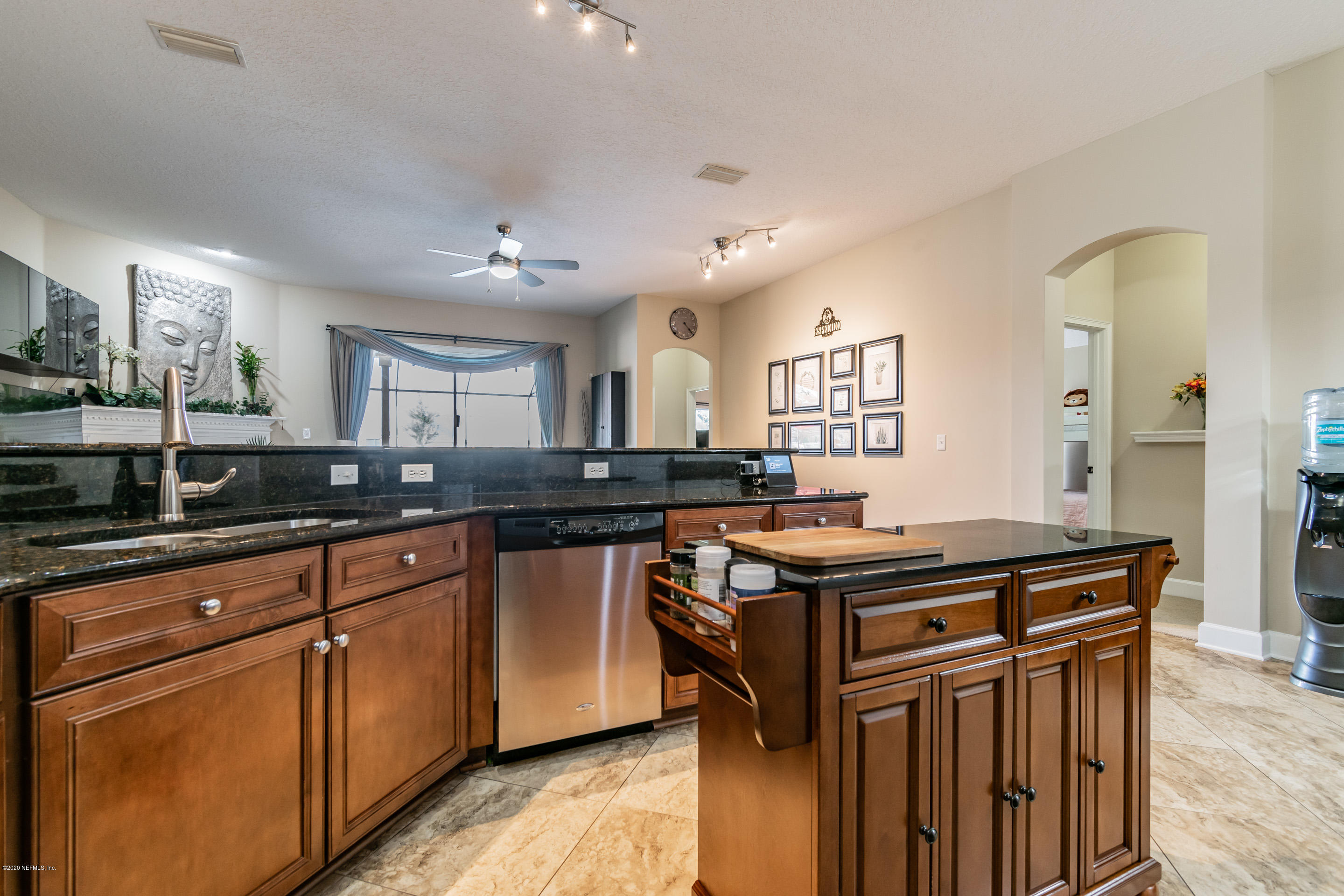 347 Porta Rosa Circle St. Augustine, FL 32092 - Photo 8 of 48 a kitchen with granite countertop a sink and cabinets