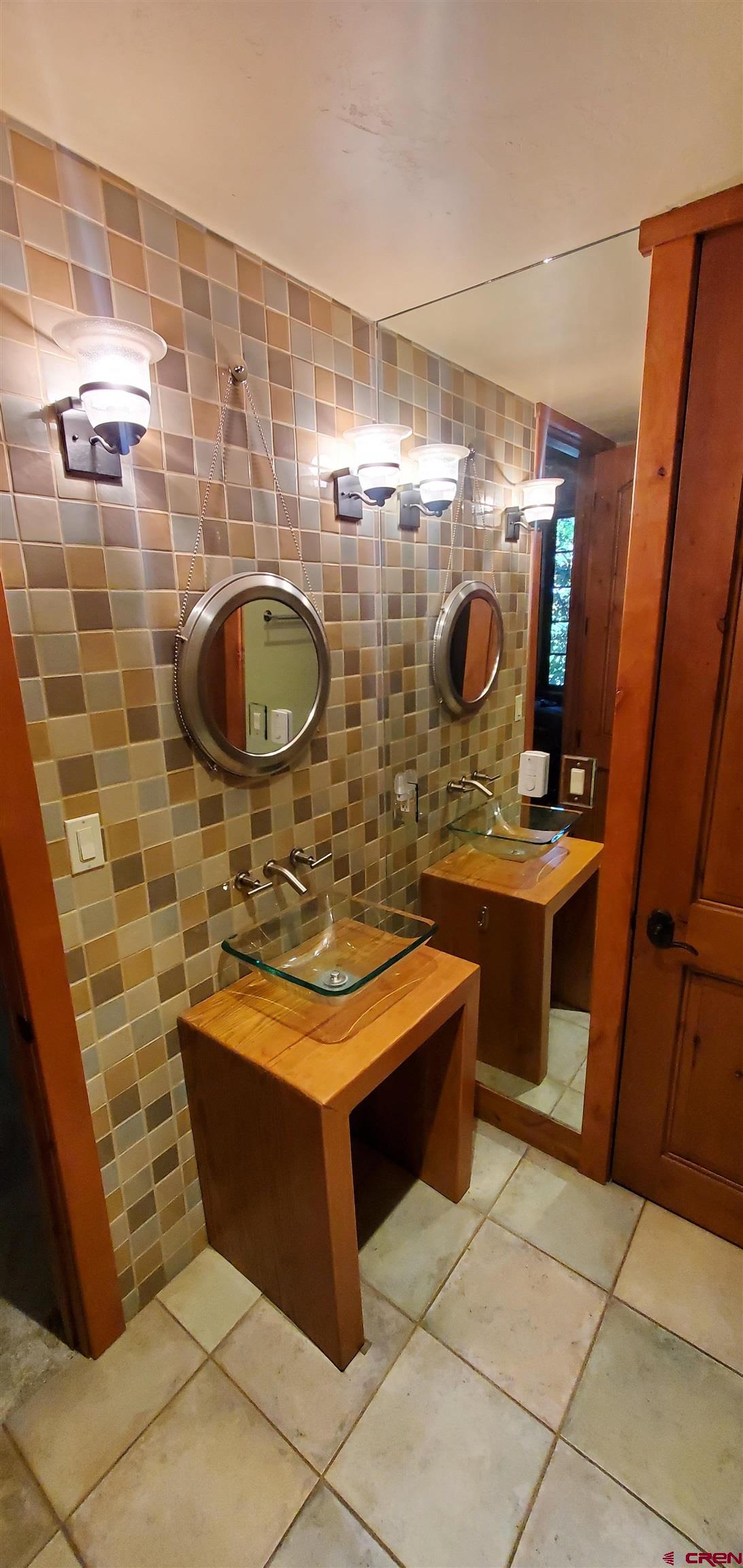 80 Twilight Trails Circle Durango, CO 81301 - Photo 13 of 26 a bathroom with a sink a mirror and shower