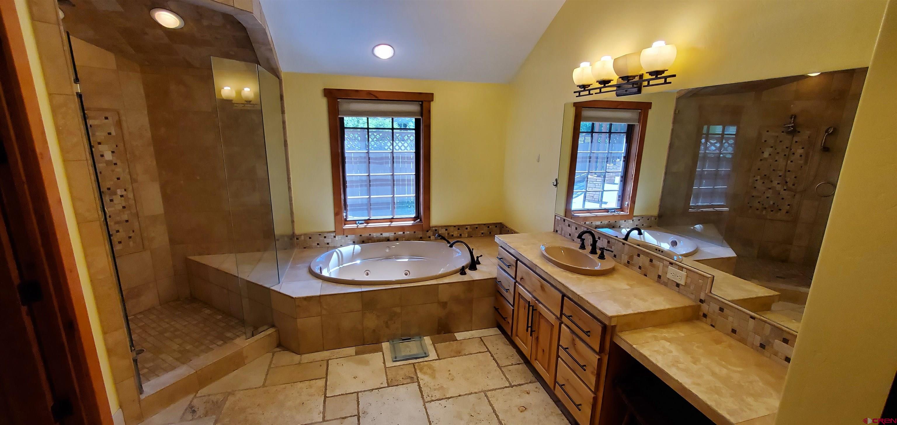 80 Twilight Trails Circle Durango, CO 81301 - Photo 18 of 26 a bathroom with a sink a vanity and a mirror
