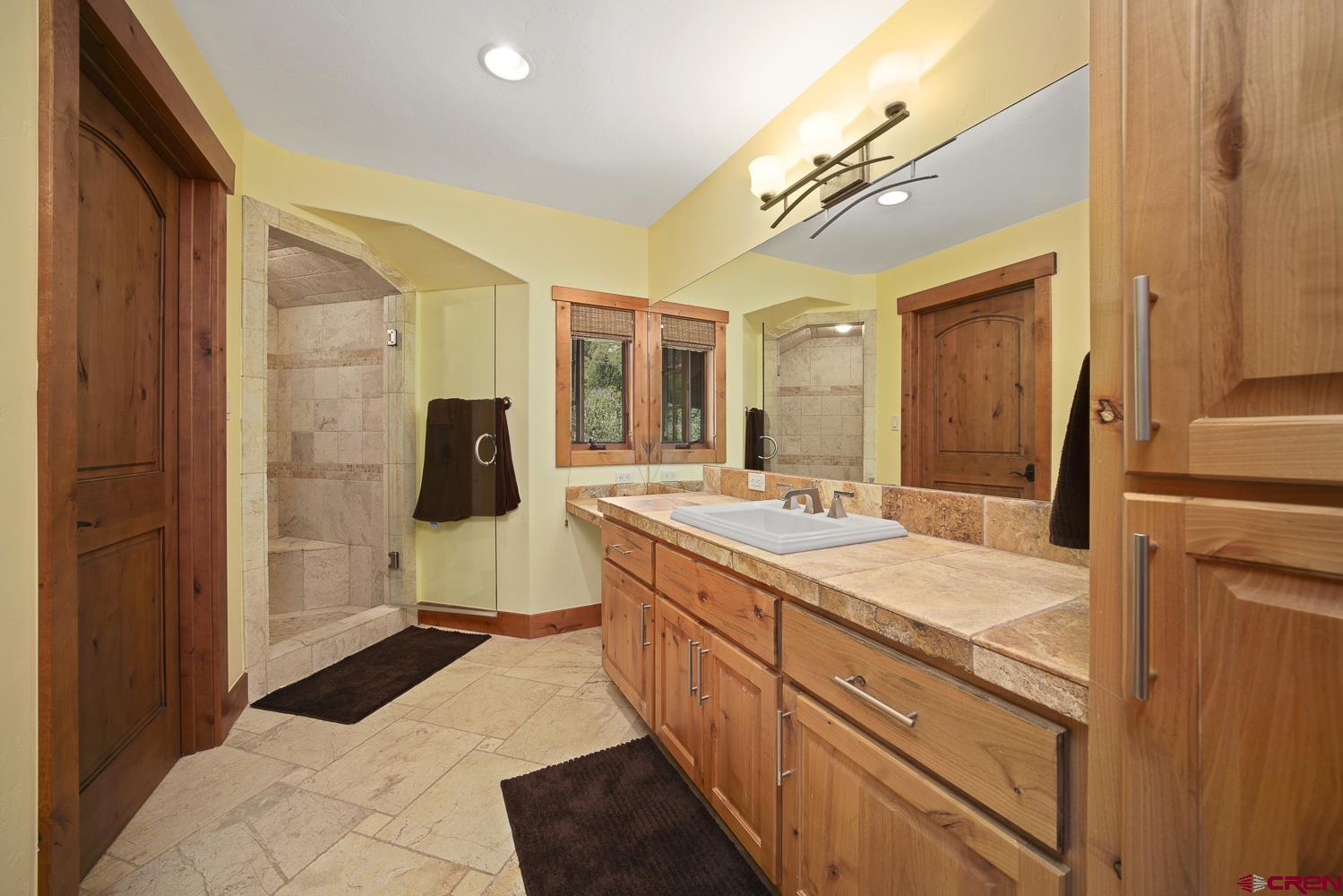 80 Twilight Trails Circle Durango, CO 81301 - Photo 20 of 26 a spacious bathroom with a sink and mirror