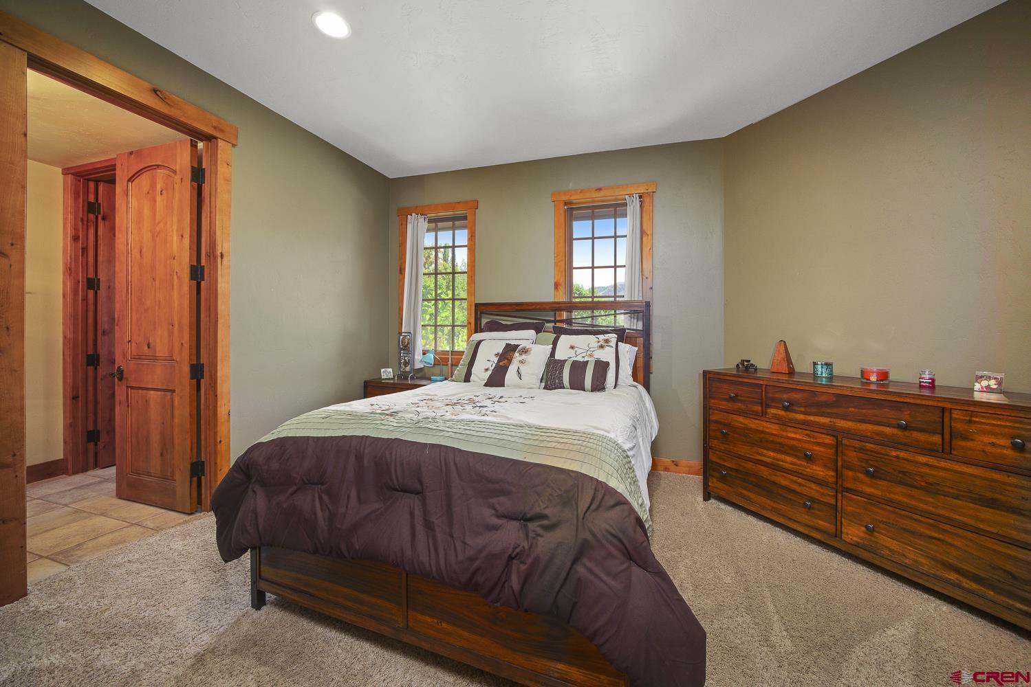80 Twilight Trails Circle Durango, CO 81301 - Photo 21 of 26 a bedroom with a bed and a window
