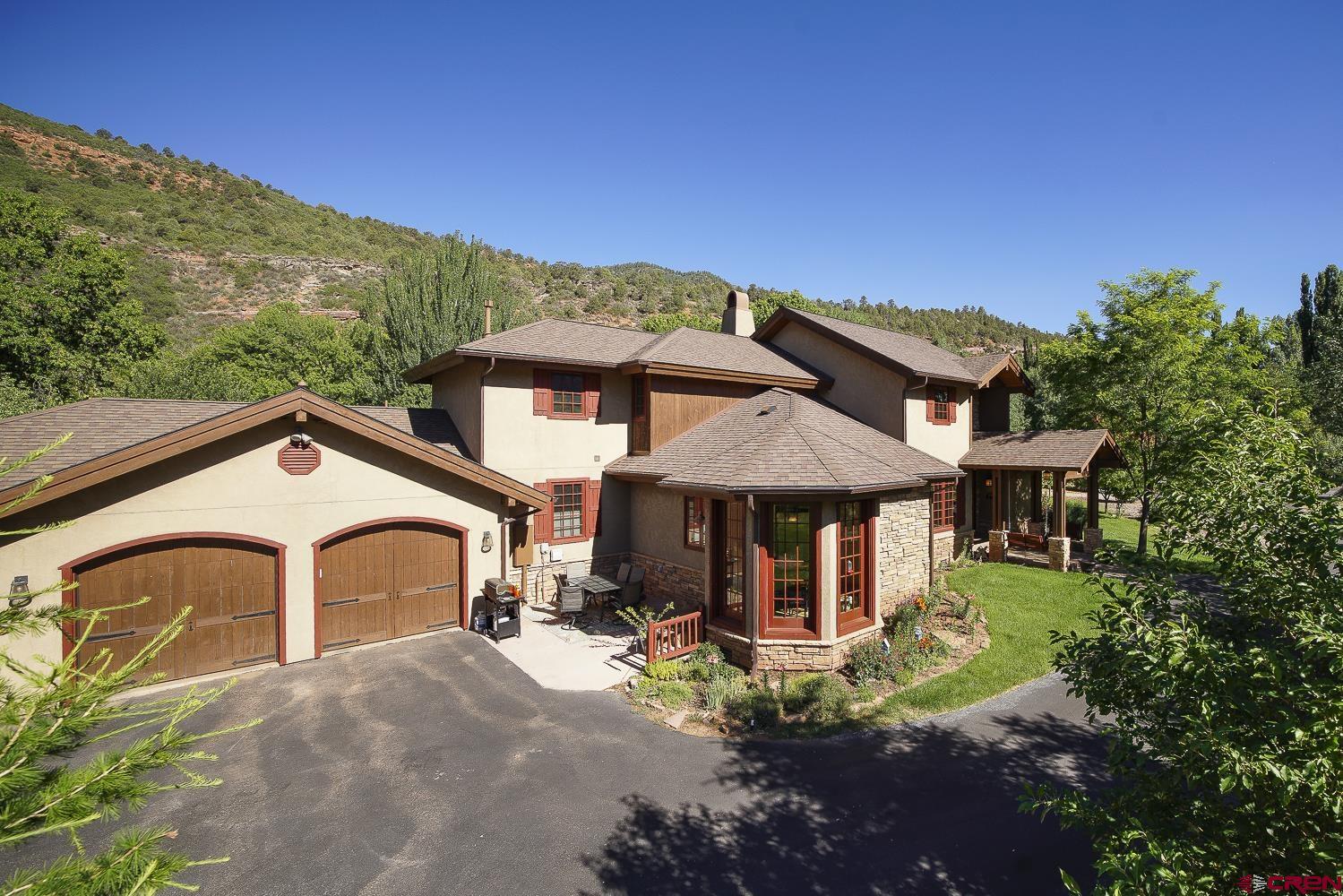 80 Twilight Trails Circle Durango, CO 81301 - Photo 3 of 26 a front view of a house with garden