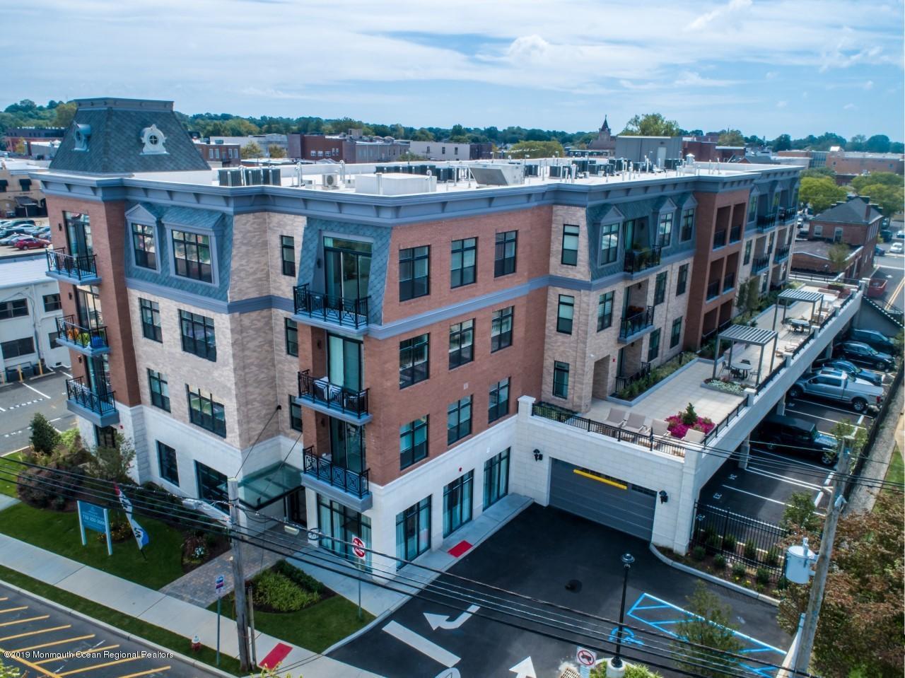 55 West Front Street, Unit 310 Red Bank, NJ 07701 - Photo 17 of 24 a city view with tall buildings